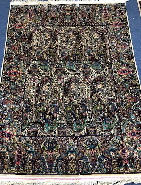 A Persian ivory ground rug 181 x 129cm